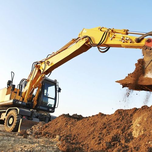 wheel loader excavator machine loading doing earthmoving work at sand quarry